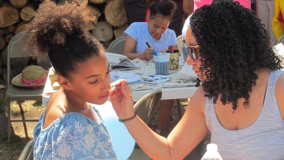 Face paint activity at community event