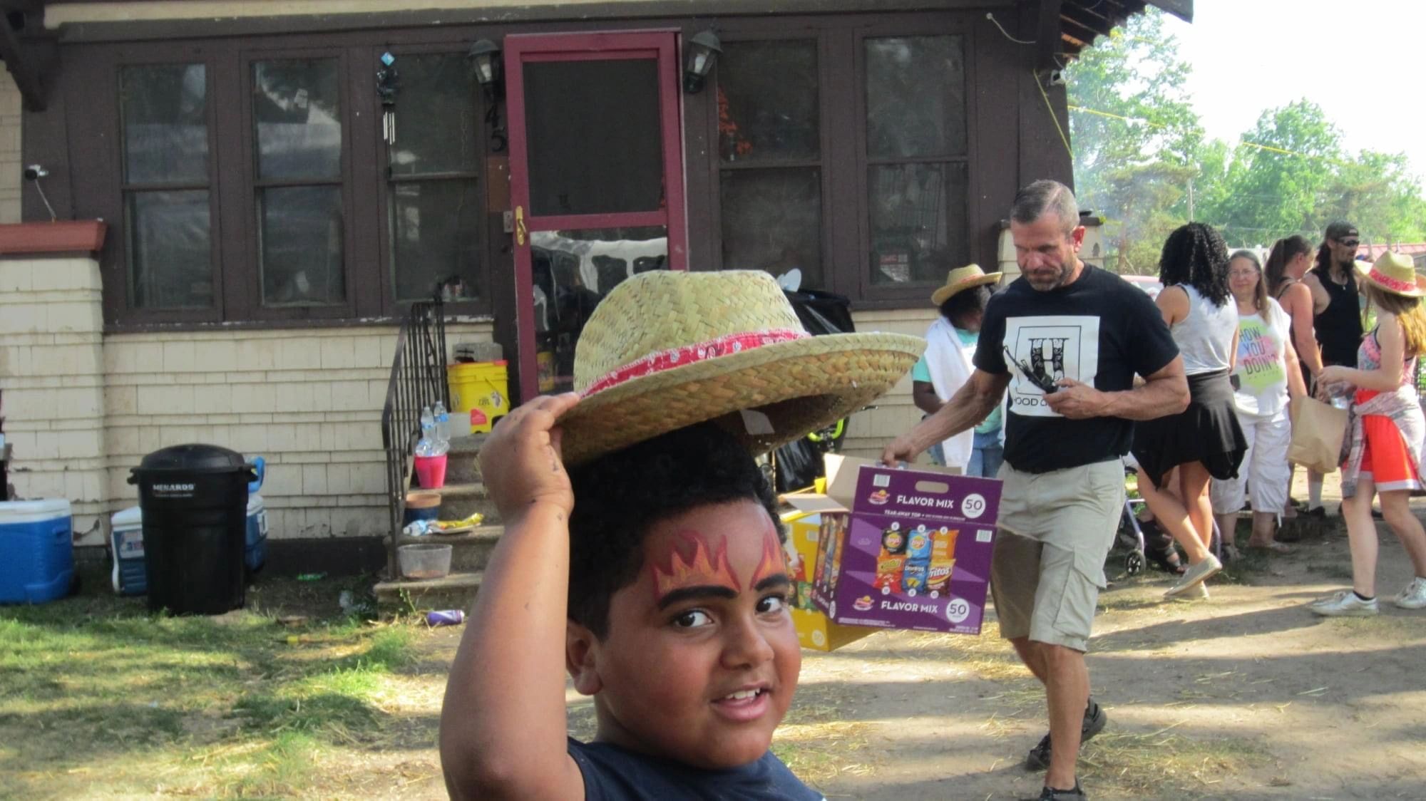 Child with face paint at festival