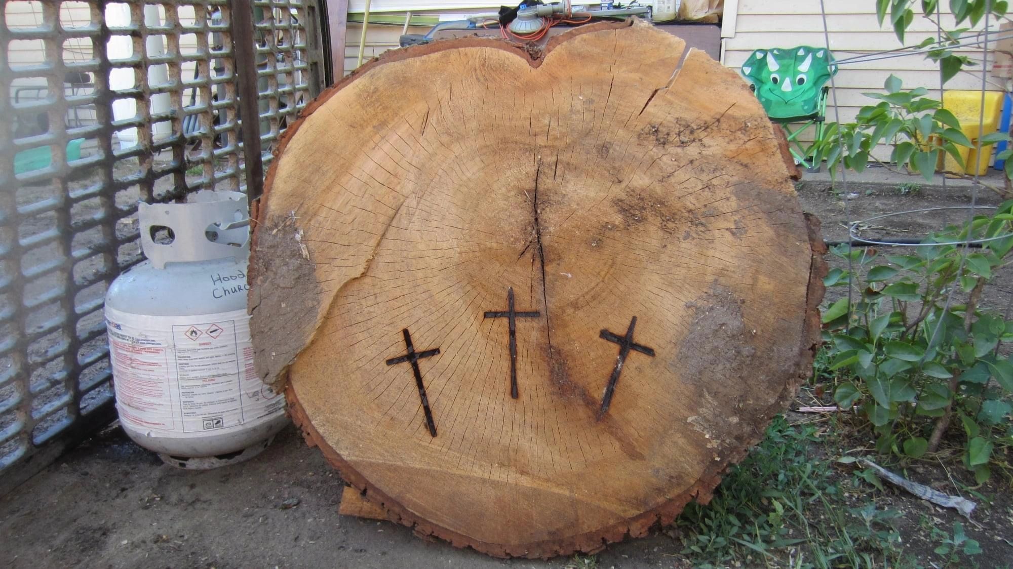 Log with three crosses