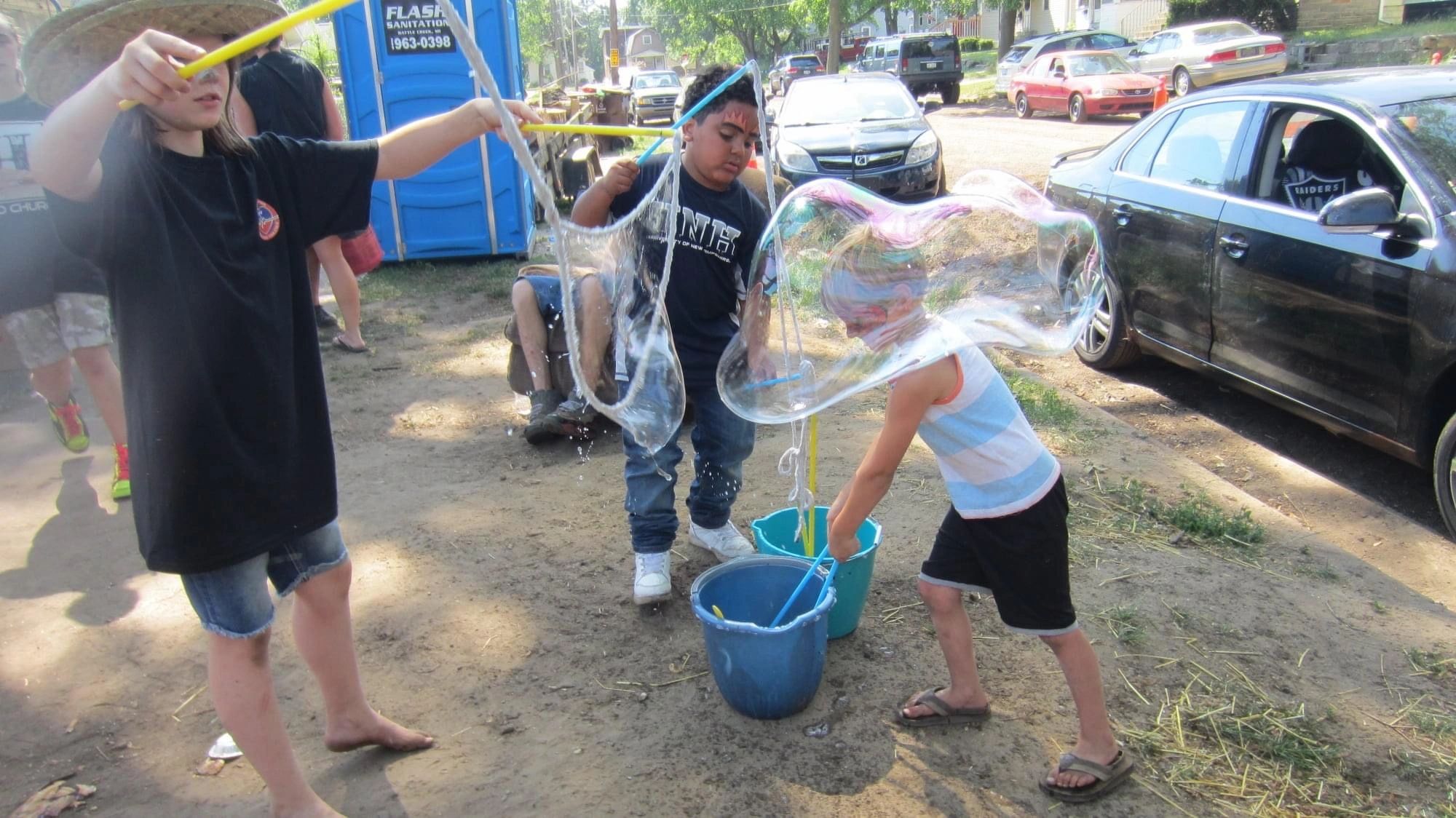 Children bubble blowing outdoor event