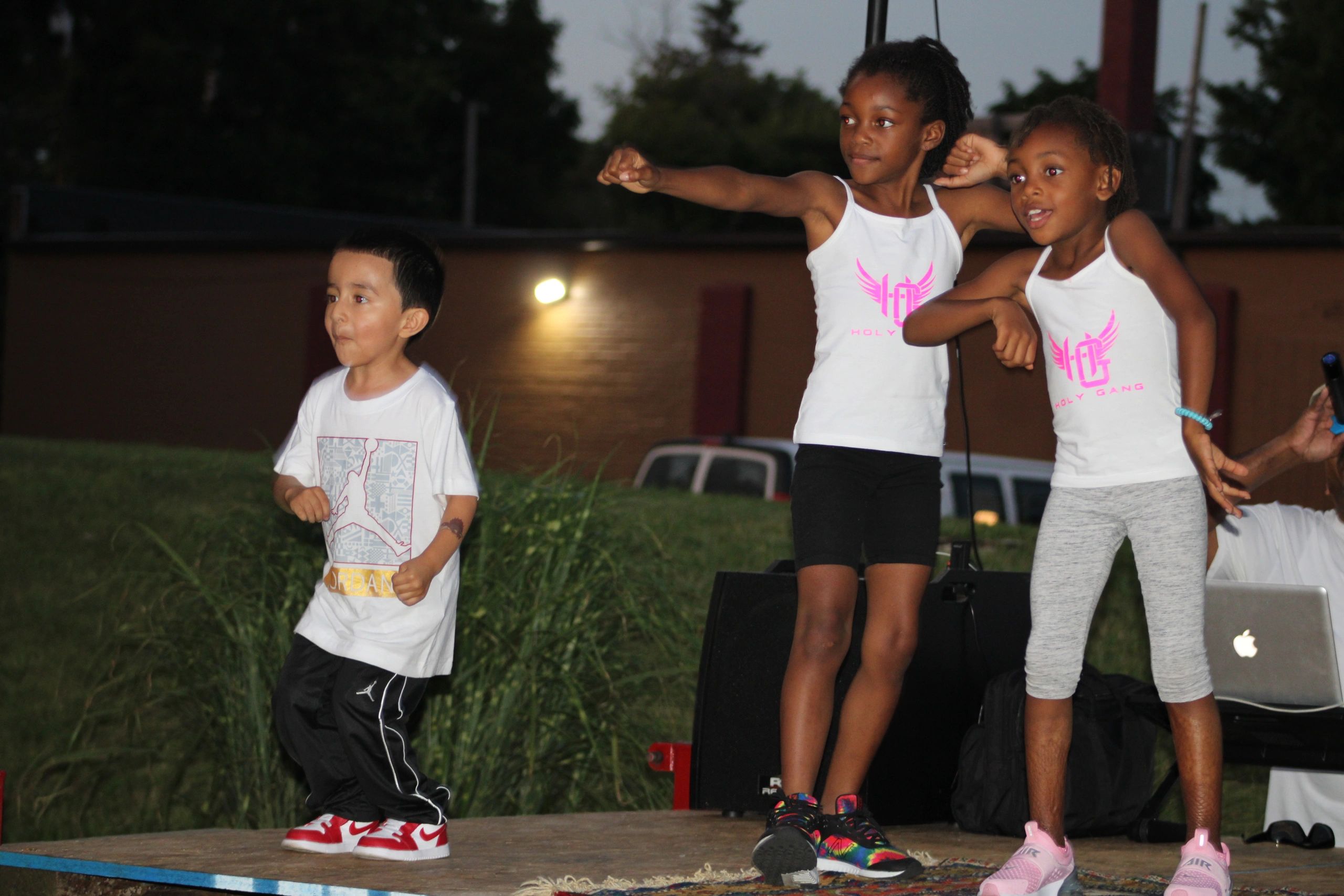Children performing on outdoor stage