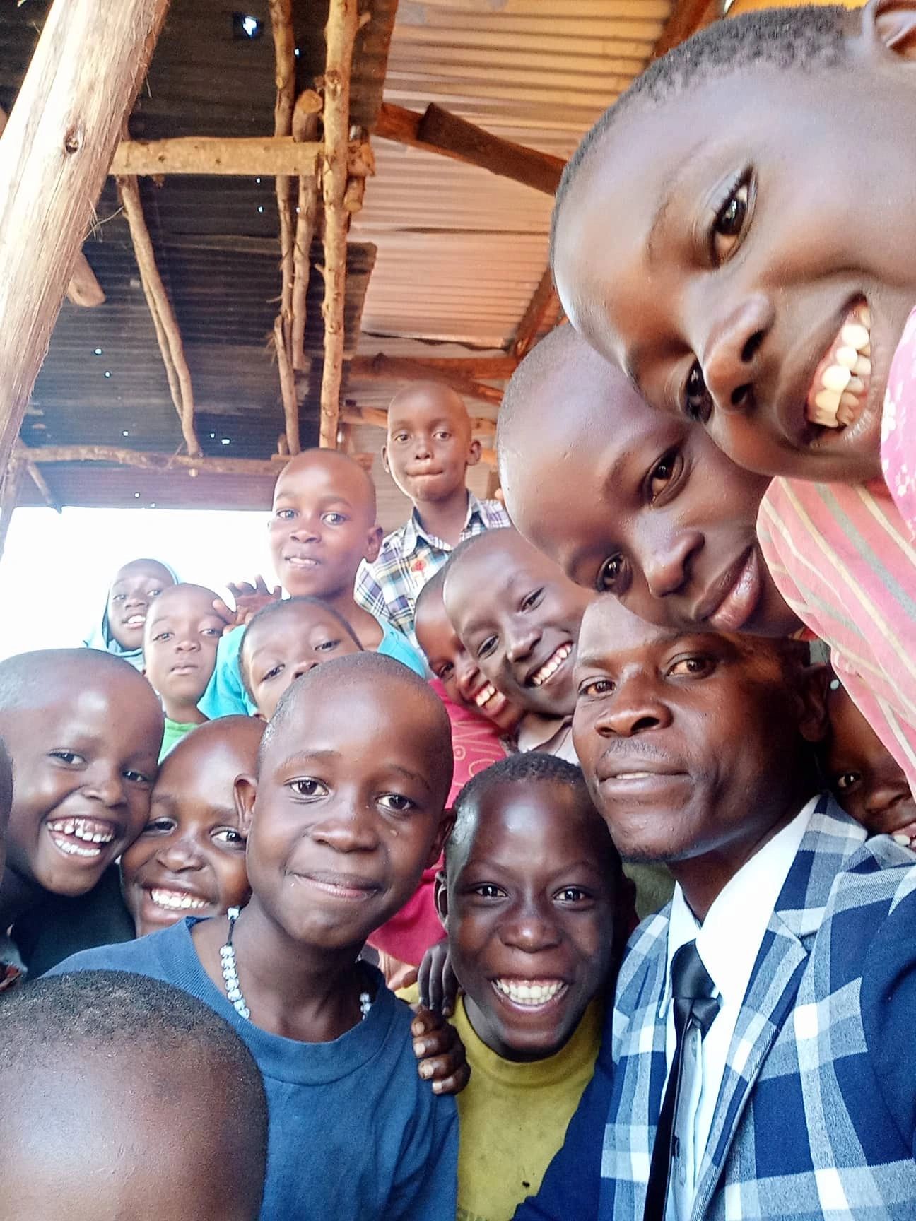 Community group selfie with children and adults